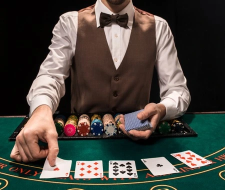 A friendly live dealer at a blackjack table